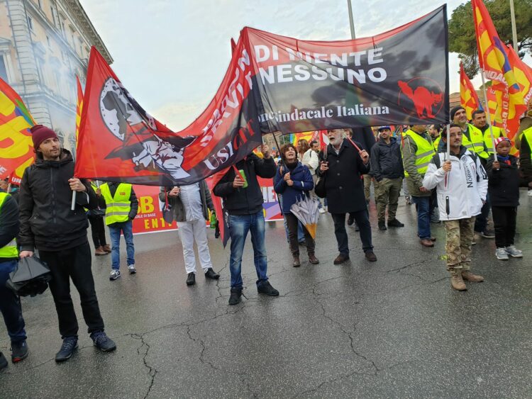 [Italy] Guns down wages up · General strike