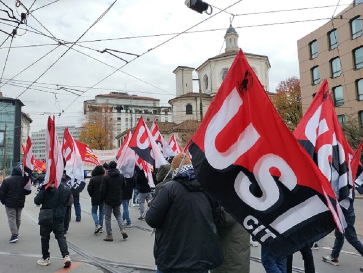 [Italy] Guns down wages up · General strike